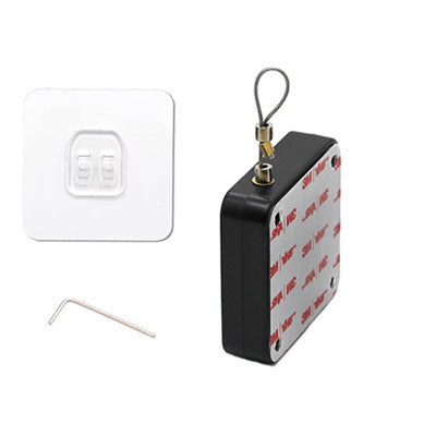 Black square anti-theft security tag with adhesive 3M backing, mounting base, and small L-shaped tool