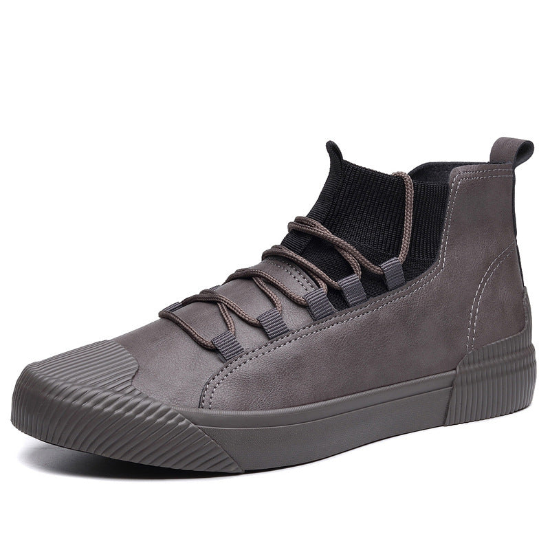 gray high-top sneaker with ribbed toe cap, knit ankle collar, and brown laces on white background