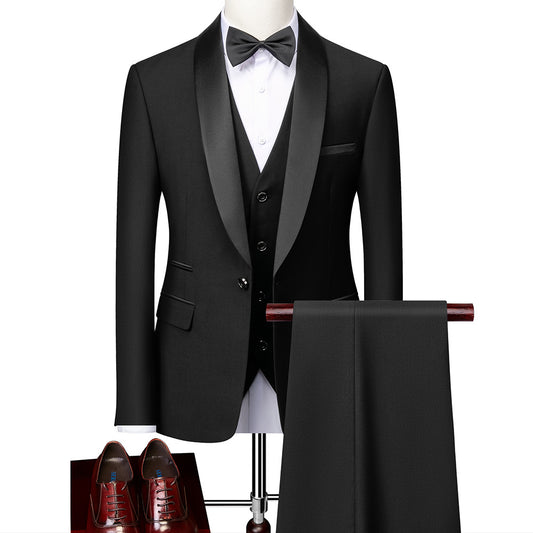 Black tuxedo with satin lapel, white dress shirt, black bow tie, matching vest, black pants, and brown leather dress shoes