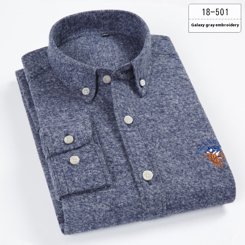 Folded gray-blue galaxy gray embroidery button-up shirt with collar and long sleeves on white background