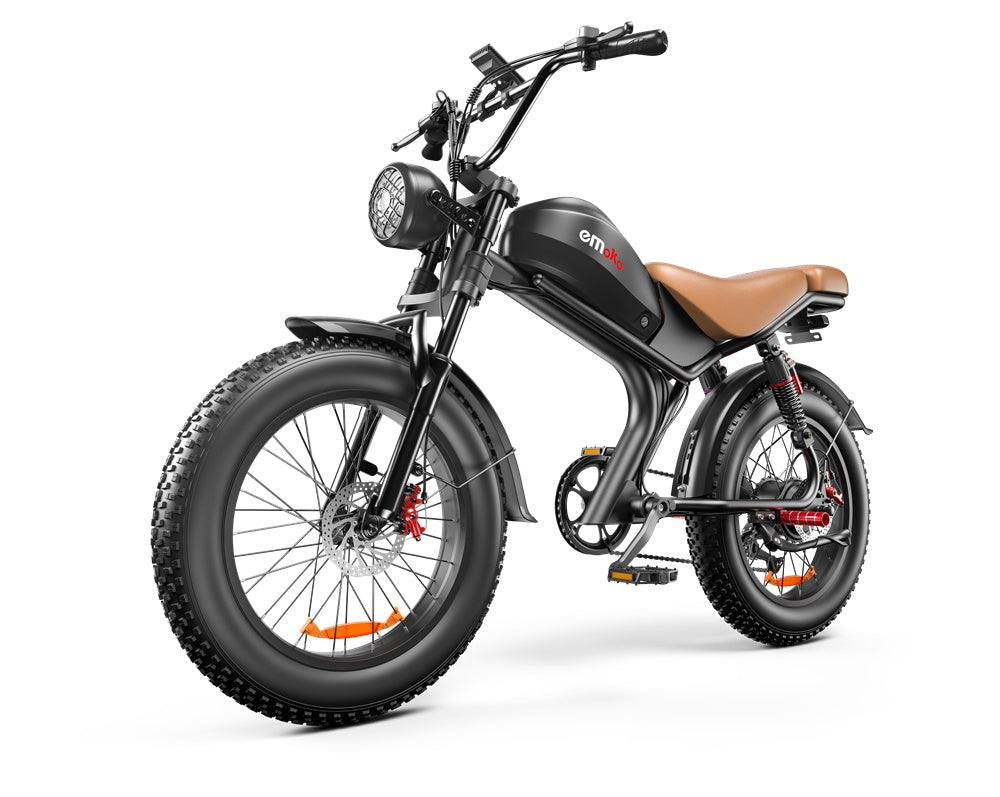 Black electric fat tire bike with brown leather seat, emoko logo, front headlight, and disc brakes