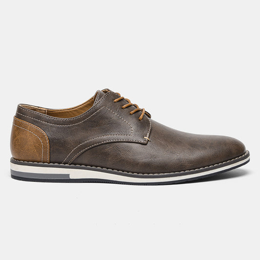Brown leather men's dress shoe with white stitching, tan heel accent, and lace-up design