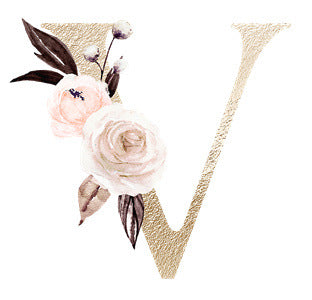 Gold textured letter V adorned with delicate pink and white watercolor flowers and leaves