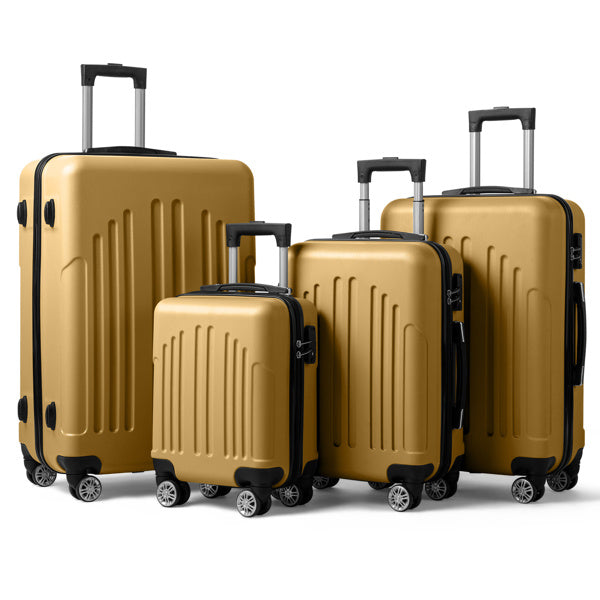 Set of four gold hard-shell suitcases with black details and telescopic handles on white background