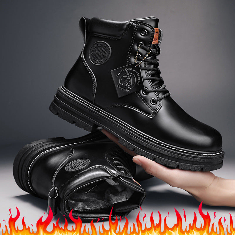 Black leather winter boots with rugged soles and warm inner lining, showcased on hand