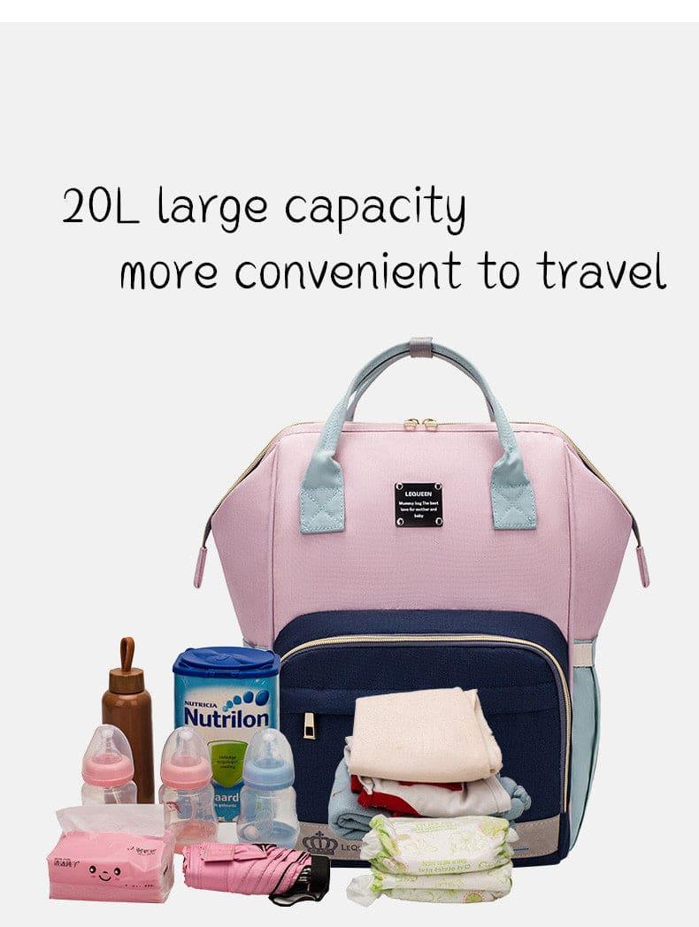 Pink and blue 20L capacity baby diaper bag with bottles, formula, diapers, blanket, and umbrella