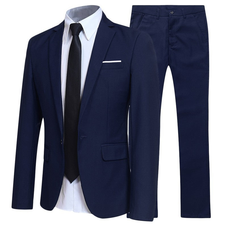 Men's navy blue suit with blazer, matching trousers, white dress shirt, and black tie