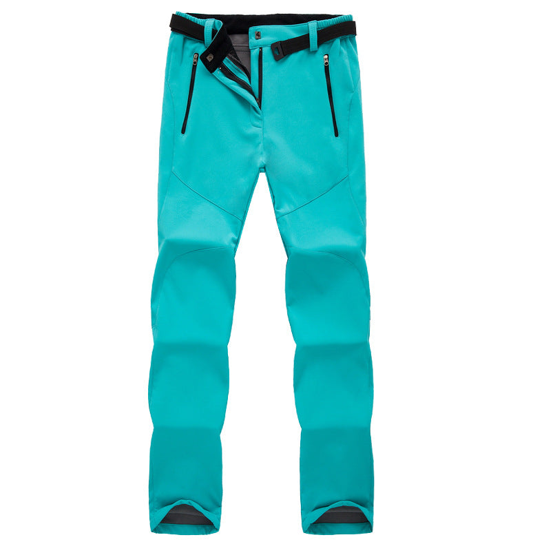 Turquoise outdoor softshell pants with black adjustable belt and zippered side pockets