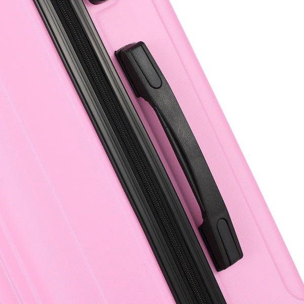 Close-up of pink hard-shell suitcase with black zipper and handle detail