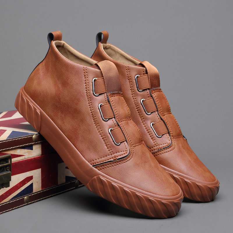 Brown leather slip-on casual sneakers with textured sole on Union Jack patterned box