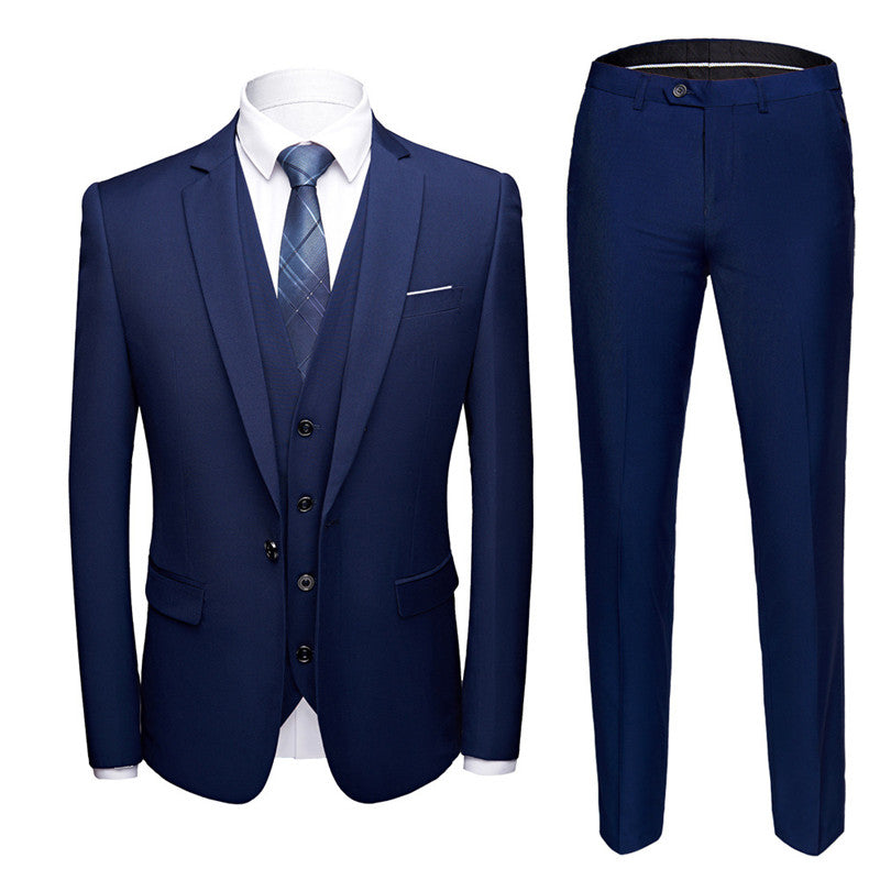 Navy blue men's three-piece suit with blazer, waistcoat, pants, white shirt and navy tie