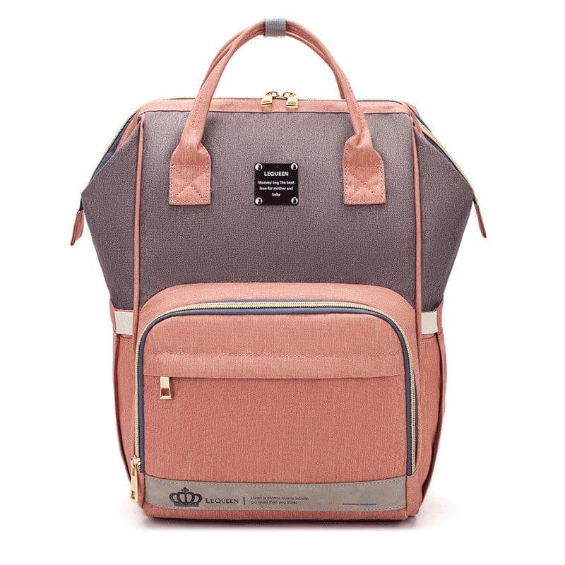 Two-tone pink and gray Lequeen backpack with top handles, front zip pocket, and gold zippers