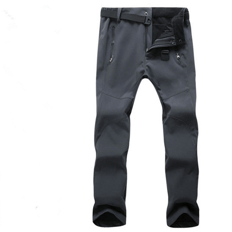 Dark gray outdoor hiking pants with zippered pockets and adjustable waistband on white background