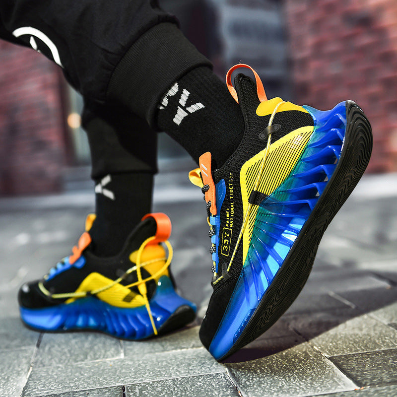 Trendy black and yellow sports sneakers with blue translucent soles on urban pavement