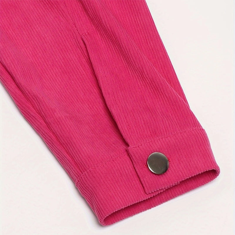 Close-up of pink corduroy sleeve cuff with silver button detail on white background