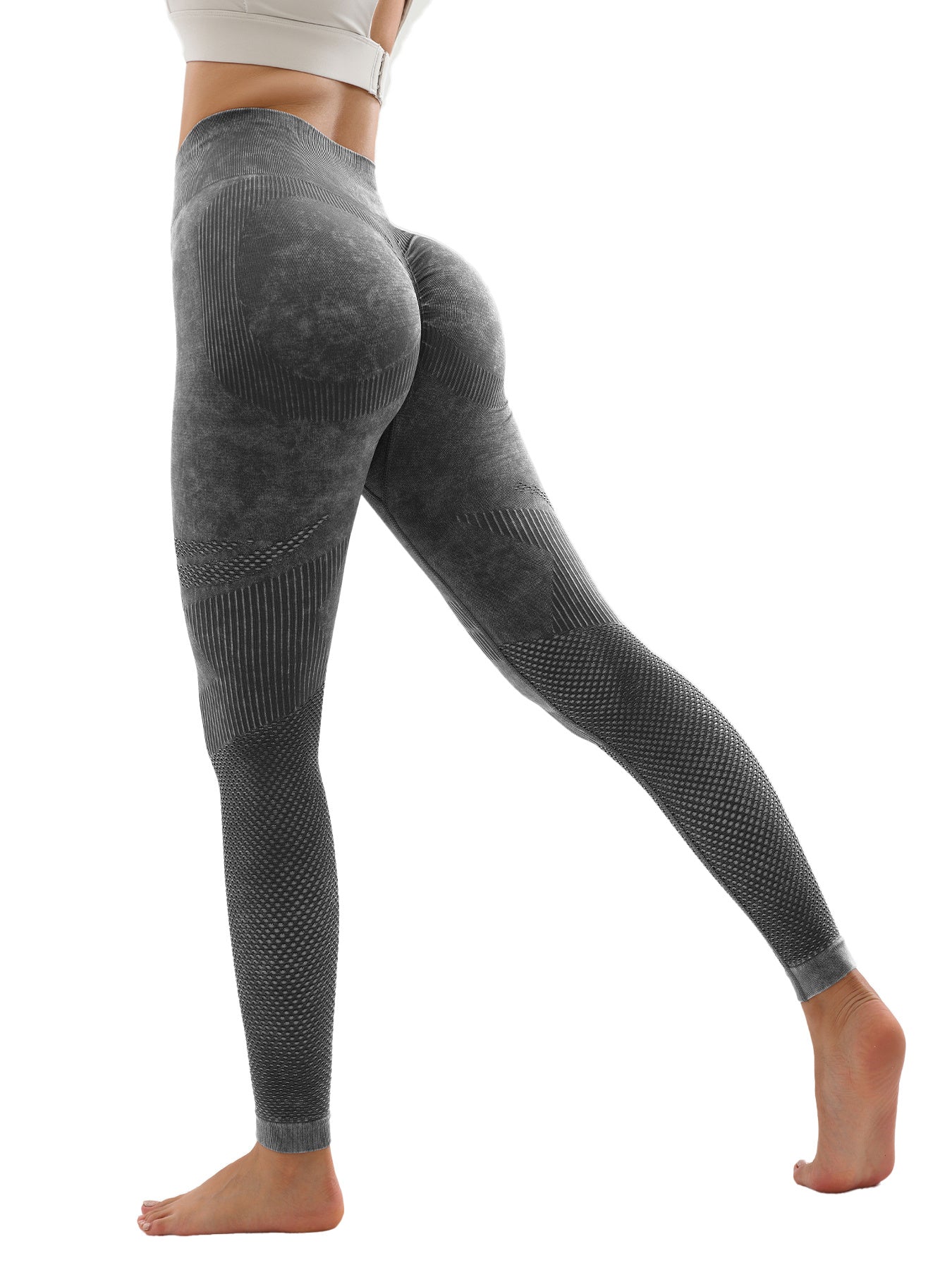 Woman wearing seamless high-waist textured black yoga leggings with tummy control and ruched booty design