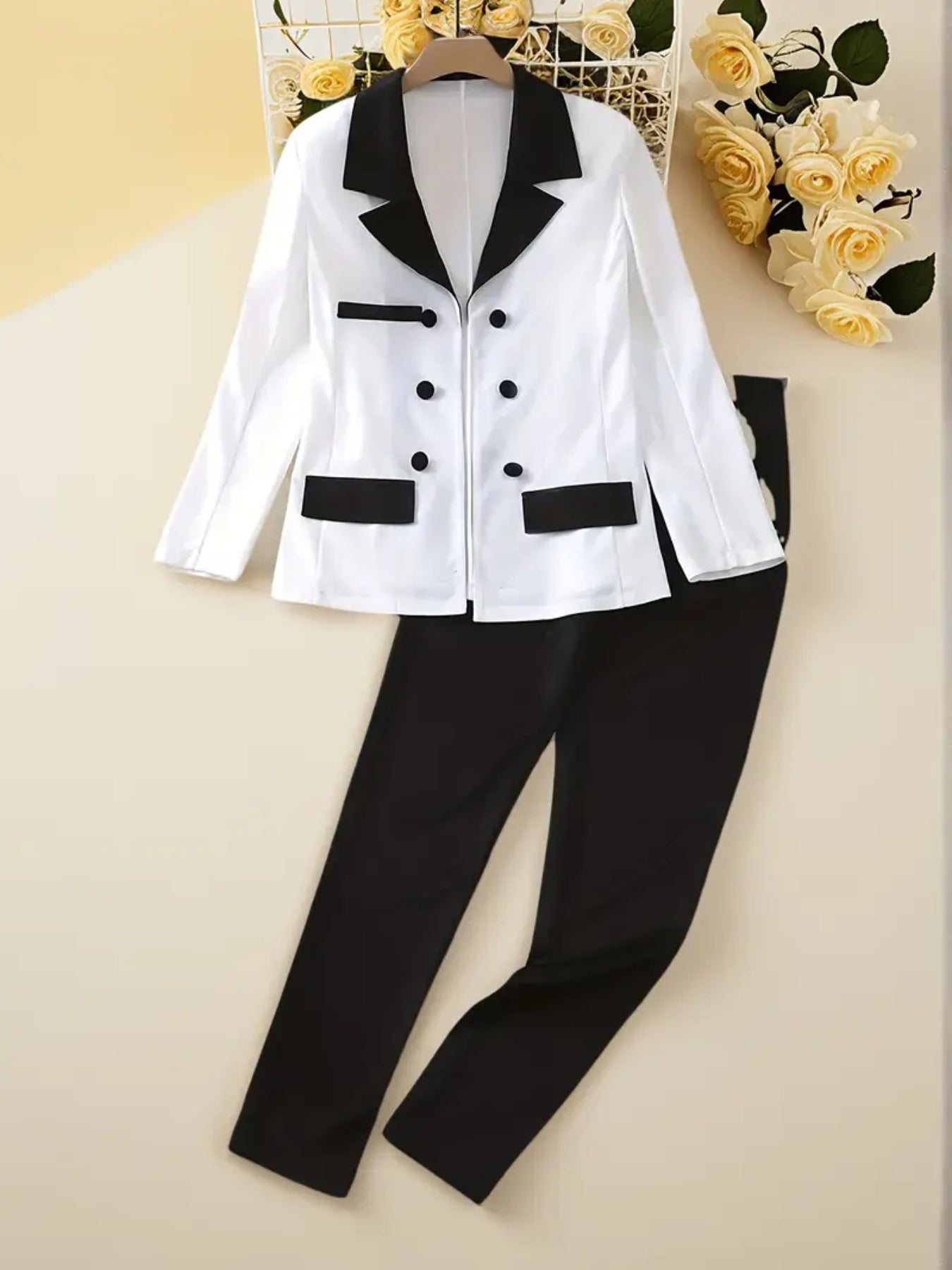 Black and white women's two-piece suit set with double-breasted blazer and straight-leg pants
