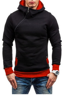 Man wearing black and red hoodie with asymmetrical zipper and jeans