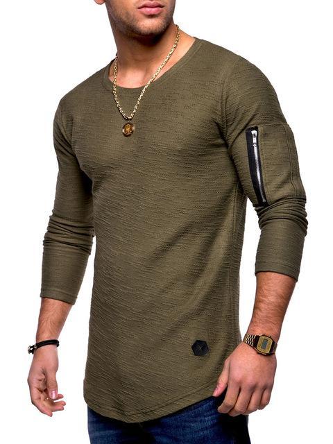 Man wearing olive green long-sleeve shirt with zippered pocket on sleeve and gold chain necklace
