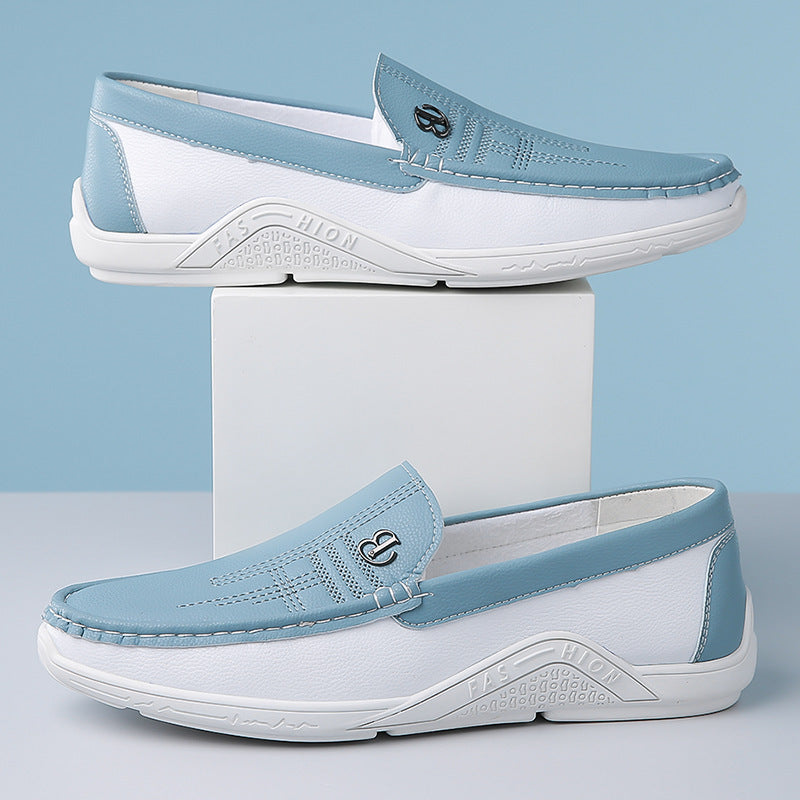 Pair of stylish blue and white leather loafers with stitched details and embossed 'FASHION' sole branding