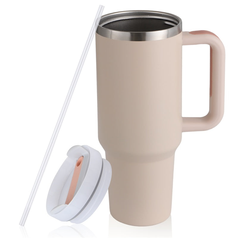 beige insulated travel mug with handle, white lid, and clear reusable straw on white background
