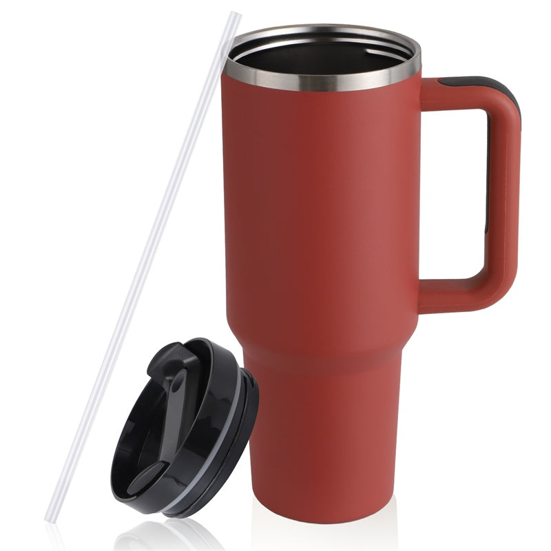 Red stainless steel travel mug with handle, black lid, and clear reusable straw on white background