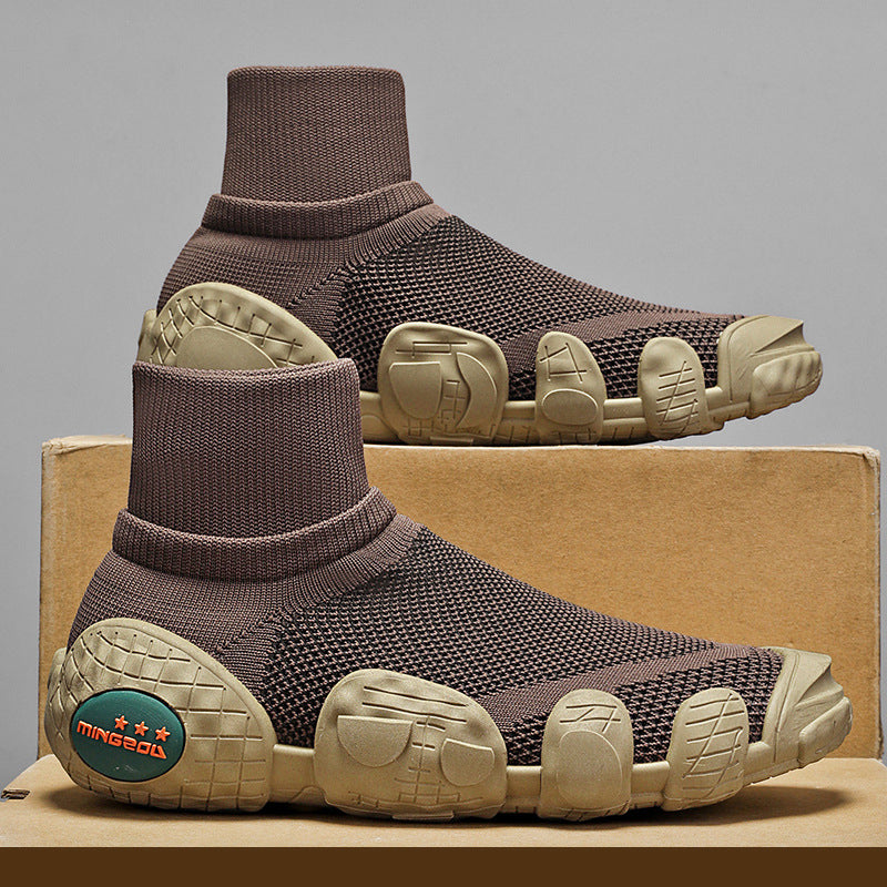 Brown knit sock-style sneakers with unique textured sole and Mingdou logo on heel, displayed on cardboard box