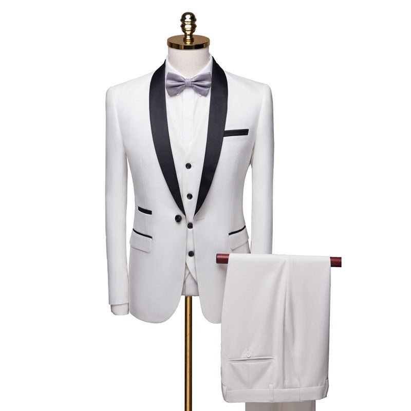 White men's three-piece wedding suit with black lapel and gray bow tie on mannequin