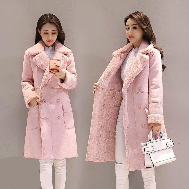 Woman modeling long pink faux fur coat with double-breasted buttons and patch pockets