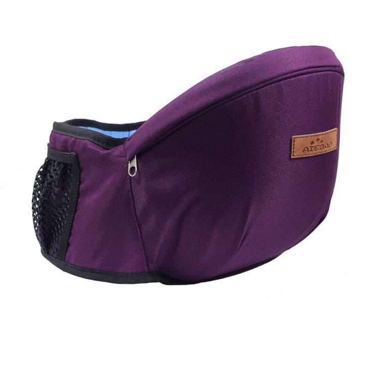 Purple baby hip seat carrier with mesh side pocket and leather logo patch on white background