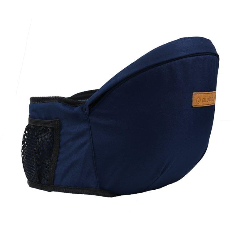 Navy blue baby hip seat carrier with mesh side pocket and brown brand patch