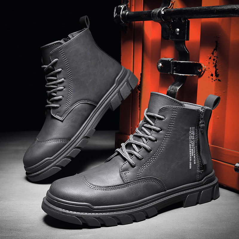 Stylish black leather lace-up ankle boots with rugged sole, displayed against an orange industrial backdrop