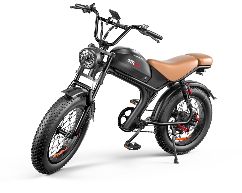 black Emaka electric bike with fat tires and brown leather seat on white background