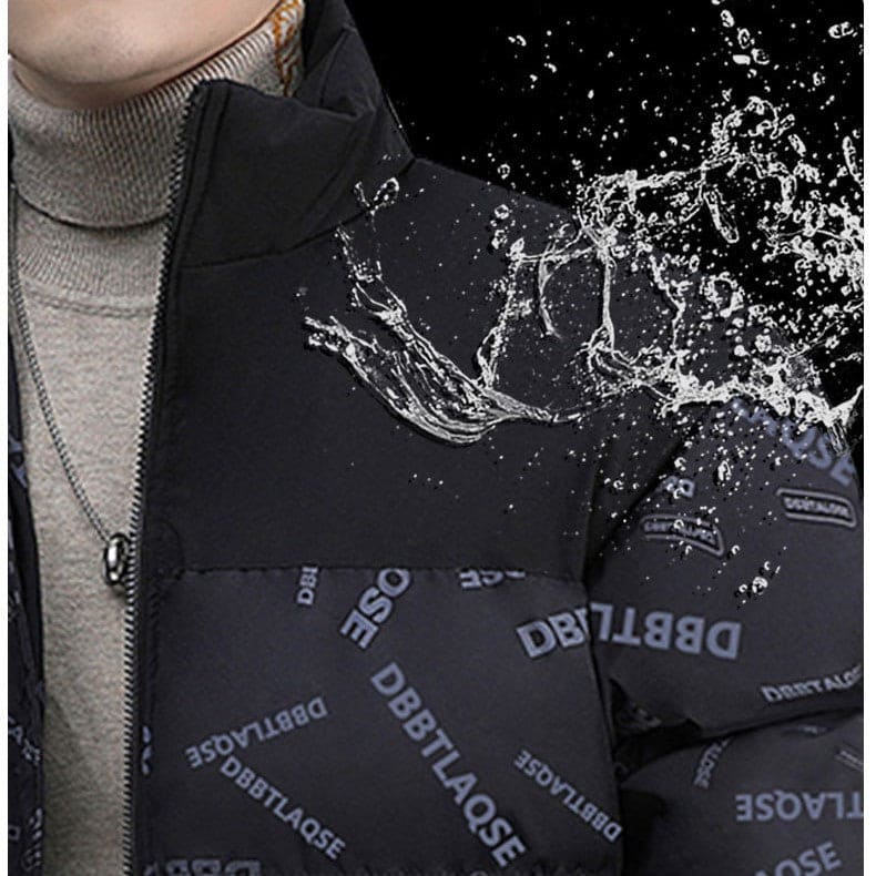Close-up of water-resistant black DBBTLAQSE patterned jacket with water splashing on shoulder