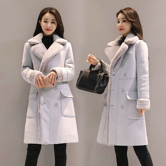 Women wearing stylish light gray double-breasted wool coat with fur collar and cuffs, black pants, and carrying black handbag