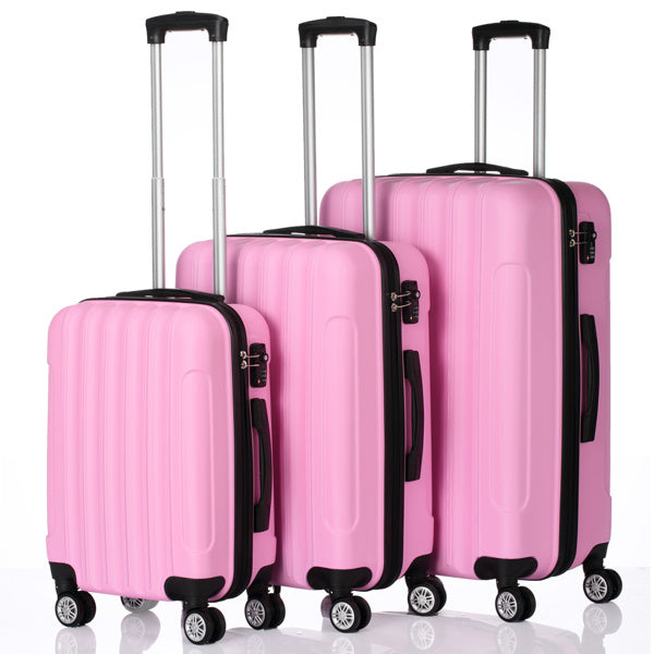 Set of three pink hard-shell suitcases with telescoping handles and spinner wheels