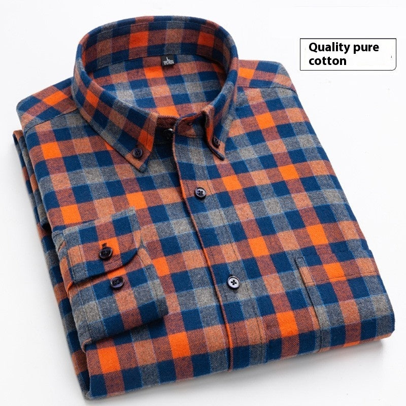 Folded checkered flannel shirt in orange, blue, and gray, made of pure cotton fabric