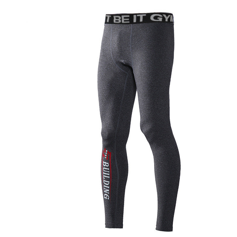 Dark gray men's gym leggings with compression fit and BUILDING text on lower leg