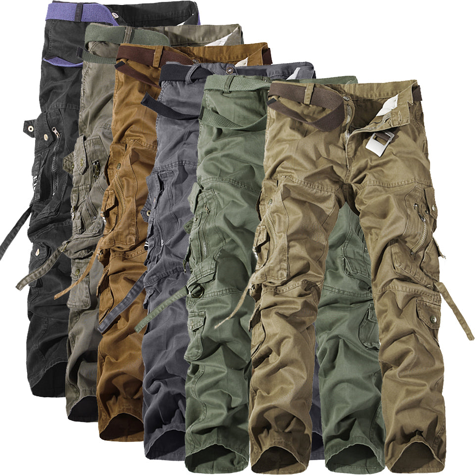 Row of rugged cargo pants in various earth tones with multiple pockets and belts