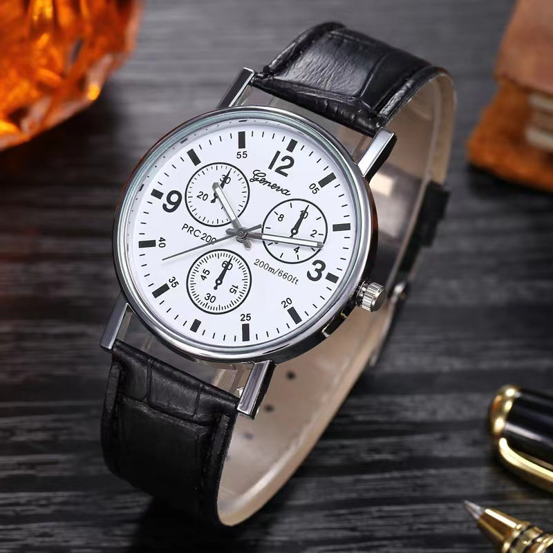 Classic Geneva wristwatch with white dial, black leather strap, and silver case on dark wooden surface