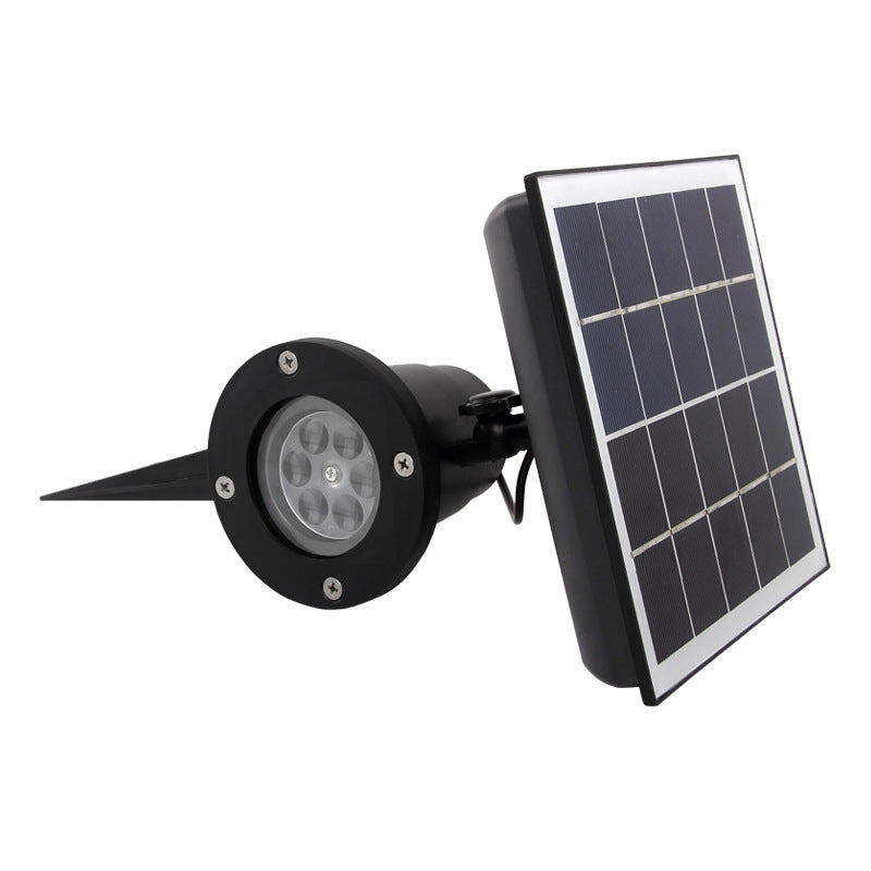 Black outdoor solar spotlight with round LED light and attached rectangular solar panel on white background