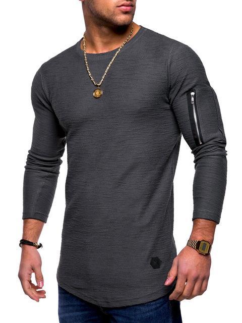 man wearing long-sleeve dark gray textured shirt with zippered arm pocket and gold accessories
