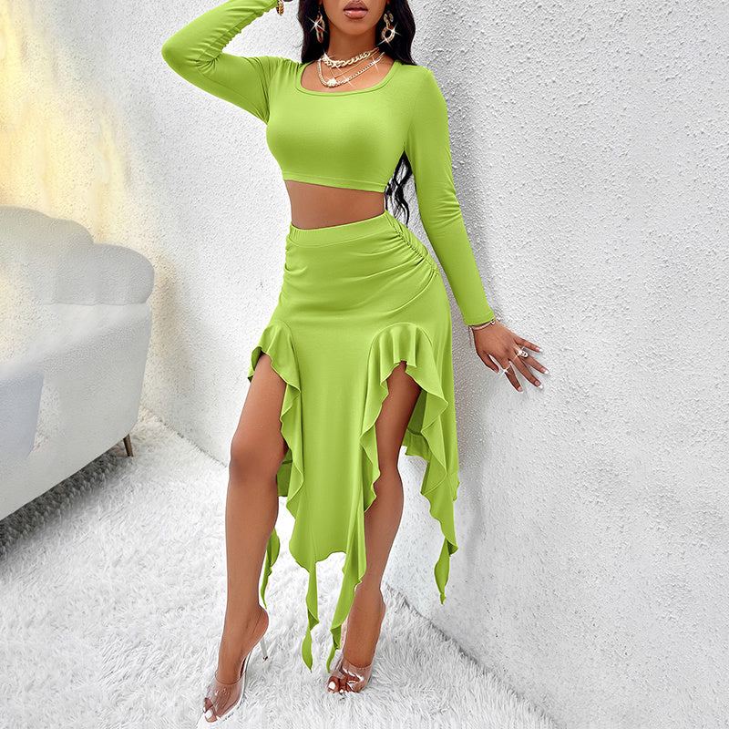 Woman wearing lime green long-sleeve crop top and asymmetrical ruffle skirt with high slits