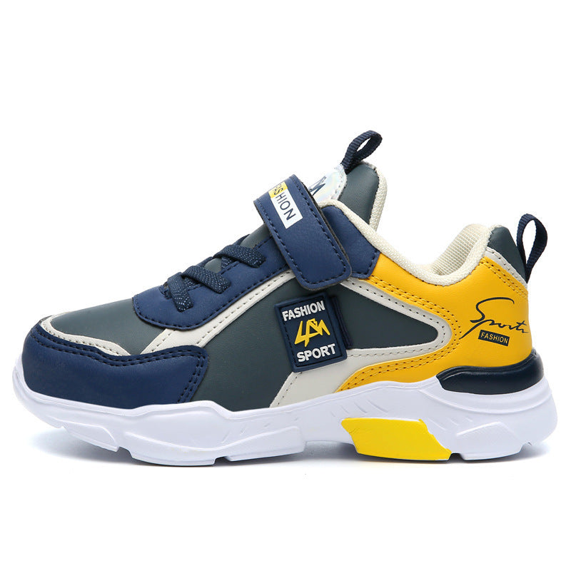 Kids' sporty sneaker shoe in navy blue, yellow, and white with fashion sport branding and Velcro strap
