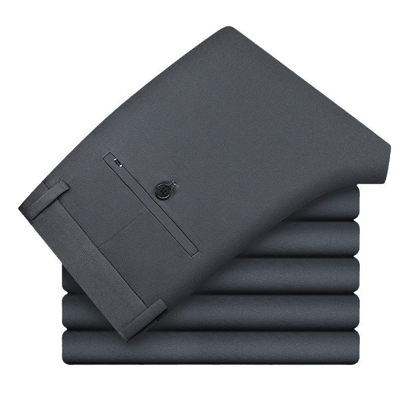 Stack of neatly folded dark gray men's dress pants with button details