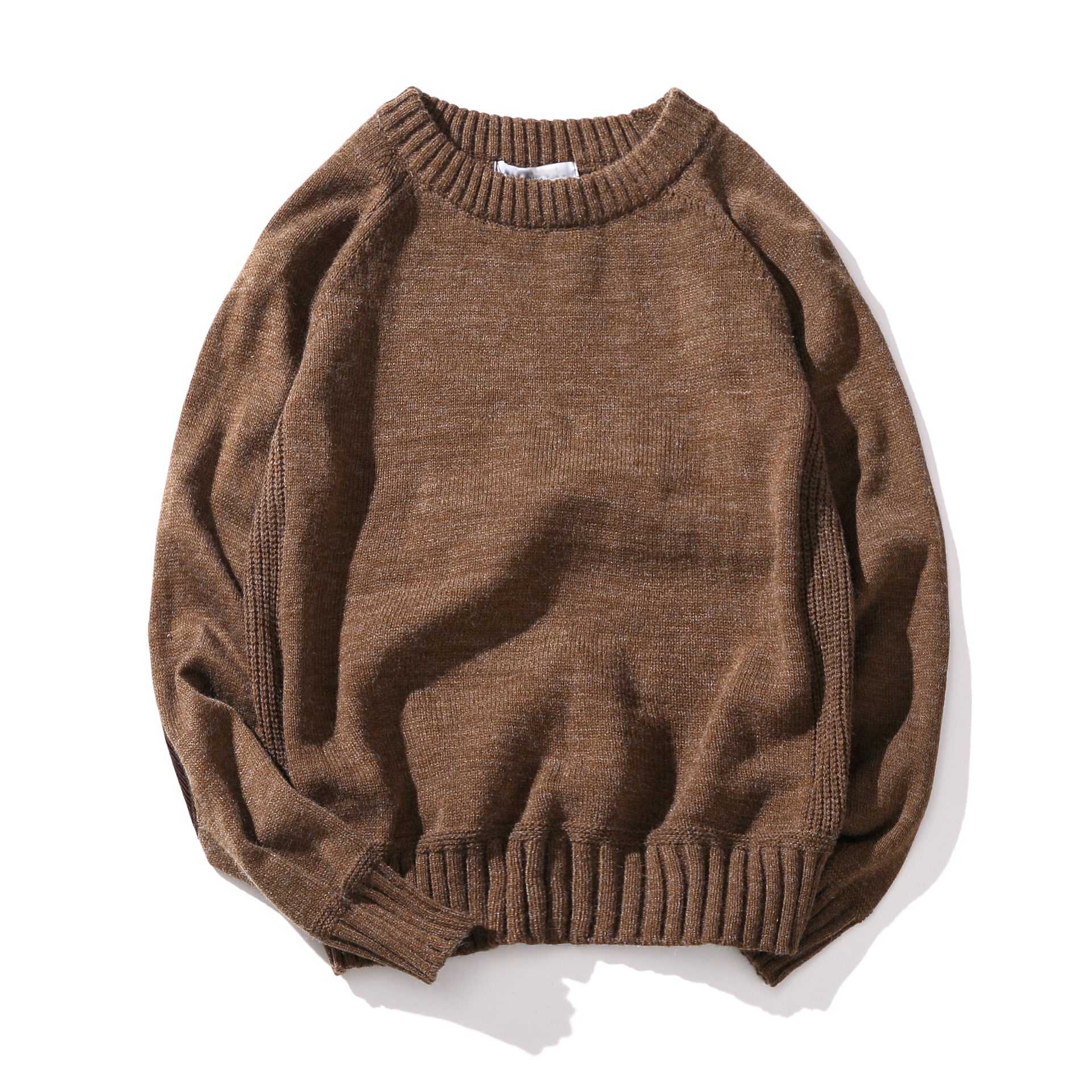 Brown knit crewneck sweater with ribbed cuffs and hem laid flat on white background