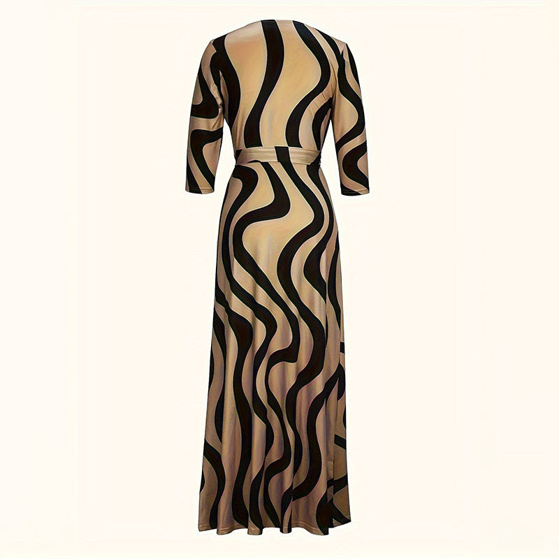 Beige and black wavy striped long-sleeve maxi dress with fitted waist and flowing skirt