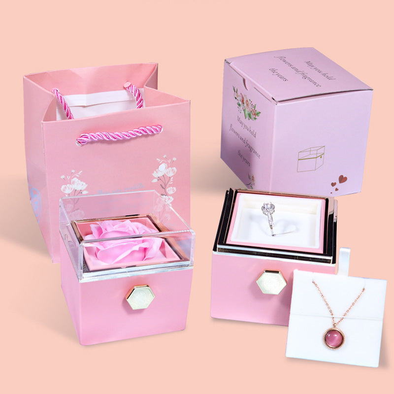Pink jewelry gift set with rose in clear box, ring in pink ring box, matching pink gift bag and floral printed box