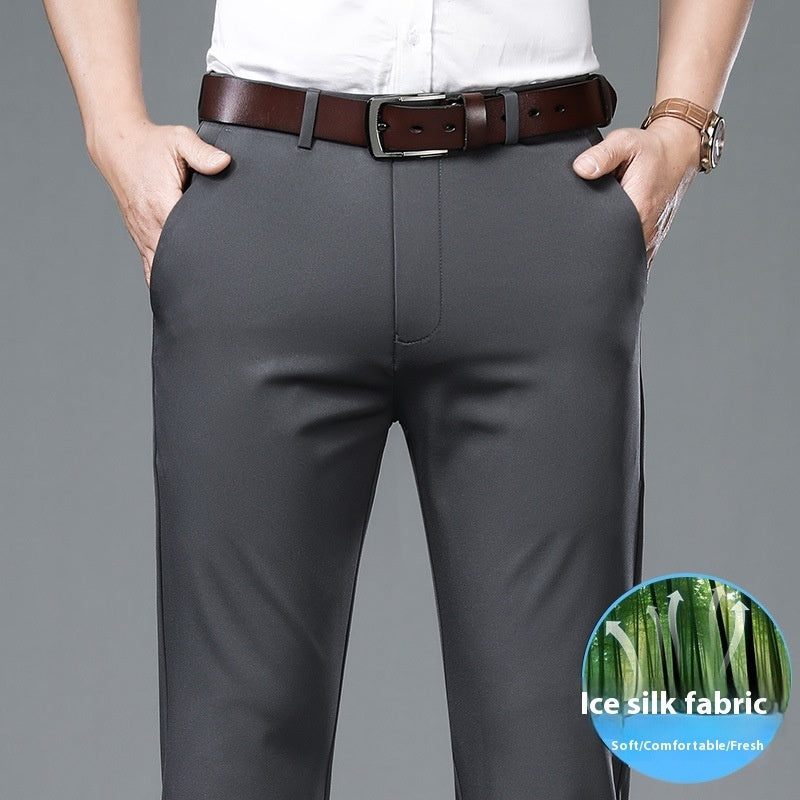 Man wearing slim fit dark gray dress pants with brown leather belt and white shirt