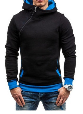 Man wearing black and blue hooded sweatshirt with asymmetric zipper and front pockets